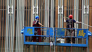 Two men working on scaffolding
