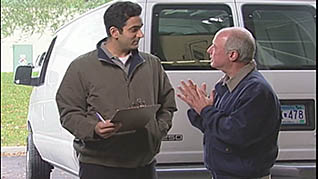Two men talking about defensive driving