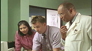 Three co-workers checking medical records