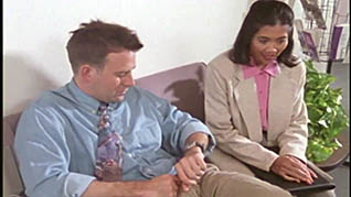 A man and women sitting in a waiting room
