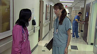 Two hospital employees discuss an issue in the conflict resolution training video