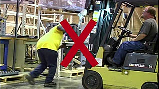 A demonstration of improper forklift use in the forklift safety training video
