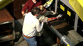 A screenshot of a worker injuring their arm from the lockout/tagout training video