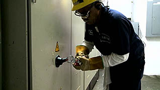 A worker tagging out in the lockout tagout training video