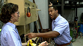 A man talking to a co-worker about safety