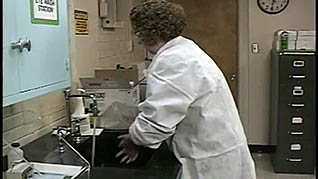 Women washing her hands after handeling bloodborne pathogens