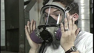 Woman wearing a gas mask