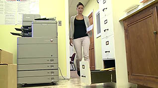 A woman leaving her cabinet open