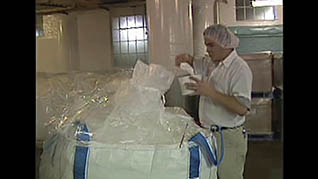 A man safely working at a food manufacturing plant