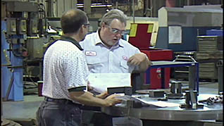 Two men in a factory