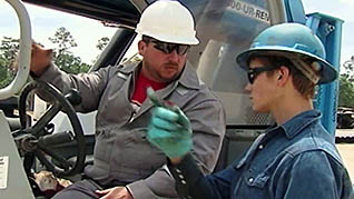 Two men having a discussion on a construction site