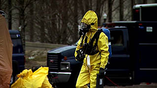 A man with a hazmat suit on