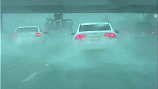 A car driving in poor conditions