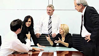 Coworkers sharpen their teamwork skills in a meeting room