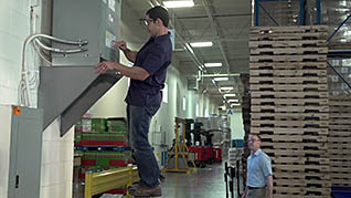 A man improperly using a ladder