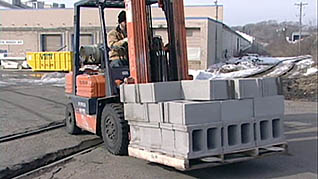 A man carrying a load on forklift