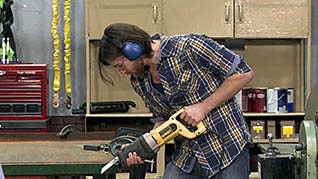 Man using power saw