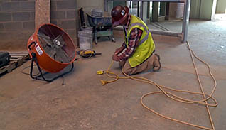 Man plugging in wires