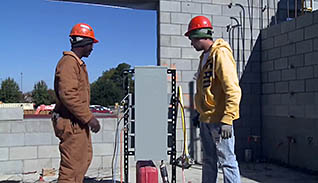 Two men working on a site