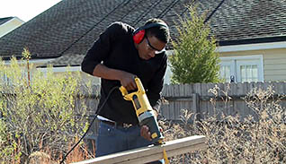 Man using power saw