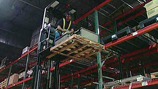 A man safely using a order picker