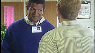 A man talking to a government employee