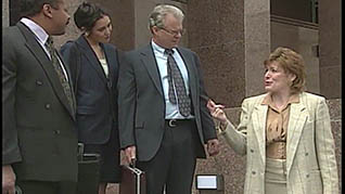 A women talking to three co-workers