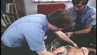 Two first responders working on a patient
