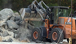 A bulldozer moving concrete