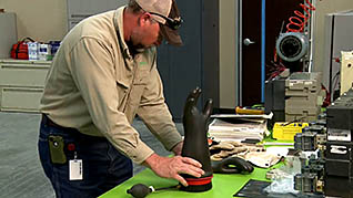 A electical worker with a rubber glove for electrical safety