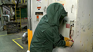 An electrical worker wears protective gear for electrical safety