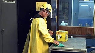 An employee in wearing safety gear in the Hazard Communication and GHS Training Video