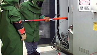 Two workers using the lockout/tagout procedures
