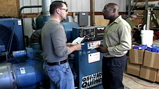 Two men discussing the importance of lockout/tagout