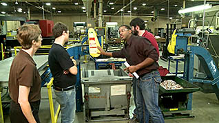 A supervisor training his co-workers on operator safety