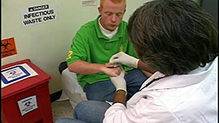 A man getting a cut attended to