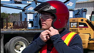 A man putting a helmet on