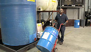 A man moving a barrel