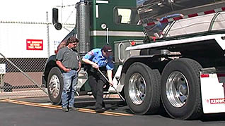 Workers washing their truck tires