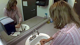 A woman thoroughly washes her hands a pandemic preparedness measure