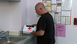 A man using a first-aid kit