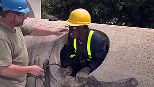A man entering a confined space