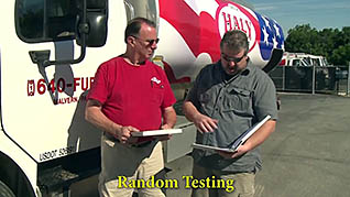 Two men talking outside of a truck
