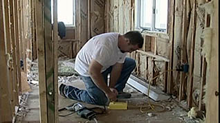 A man working on electrical circuit