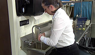 Woman washing her hands