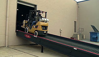 A man using a forklift ramp