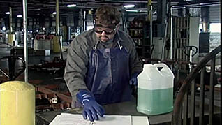 A man working with dangerous chemicals