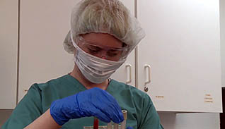A women examining test tubes