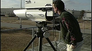 A man using a surveillance camera