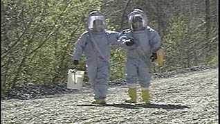 Two first responders wearing proper PPE